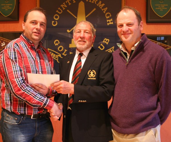 County Armagh Golf Club Captain John Flack presents Jim McCreesh with his prize after winning the Easter Stableford competition. Included is Ian Millar, category runner-up