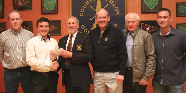 County Armagh Golf Club Captain is pictured with winners of the Waltz Classic. The winning team included Nathan Grimley (second from left), Ian O’Hea (second from right), Barry Scully (not pictured) and Conlon Rice (not pictured). Paul Corvan (left) captained the second placed team of Declan Lenagh, Kieran Mullan ad Derek McKeever. Thomas Murry (right) and Leo McCann (left) represent the third place team which included Seamus McCann and Brian McCormick