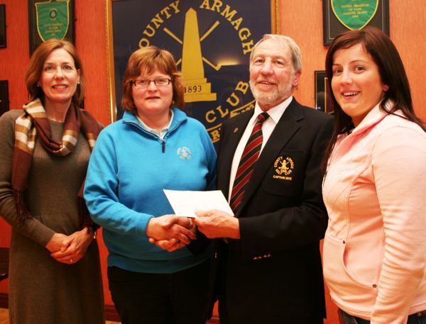 County Armagh Golf Club Captain John Flack presents Past Lady Captain Paula McCrory with her prize after winning the St Patrick's Day Open Stabelford Competition Ladies Section. Included also are runners up Elizabeth Mawhinney (left) and Catherin Corrigan.
